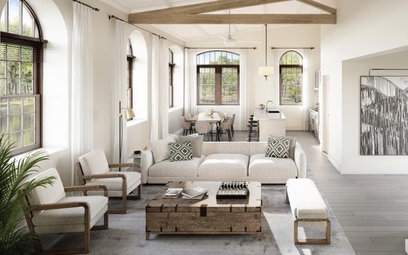 a clubroom with tables, chairs and couches